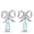 Platinum bow earrings with aquamarine teardrop and diamond pavé details