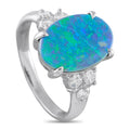 Platinum ring with oval blue-green opal center and diamond side clusters