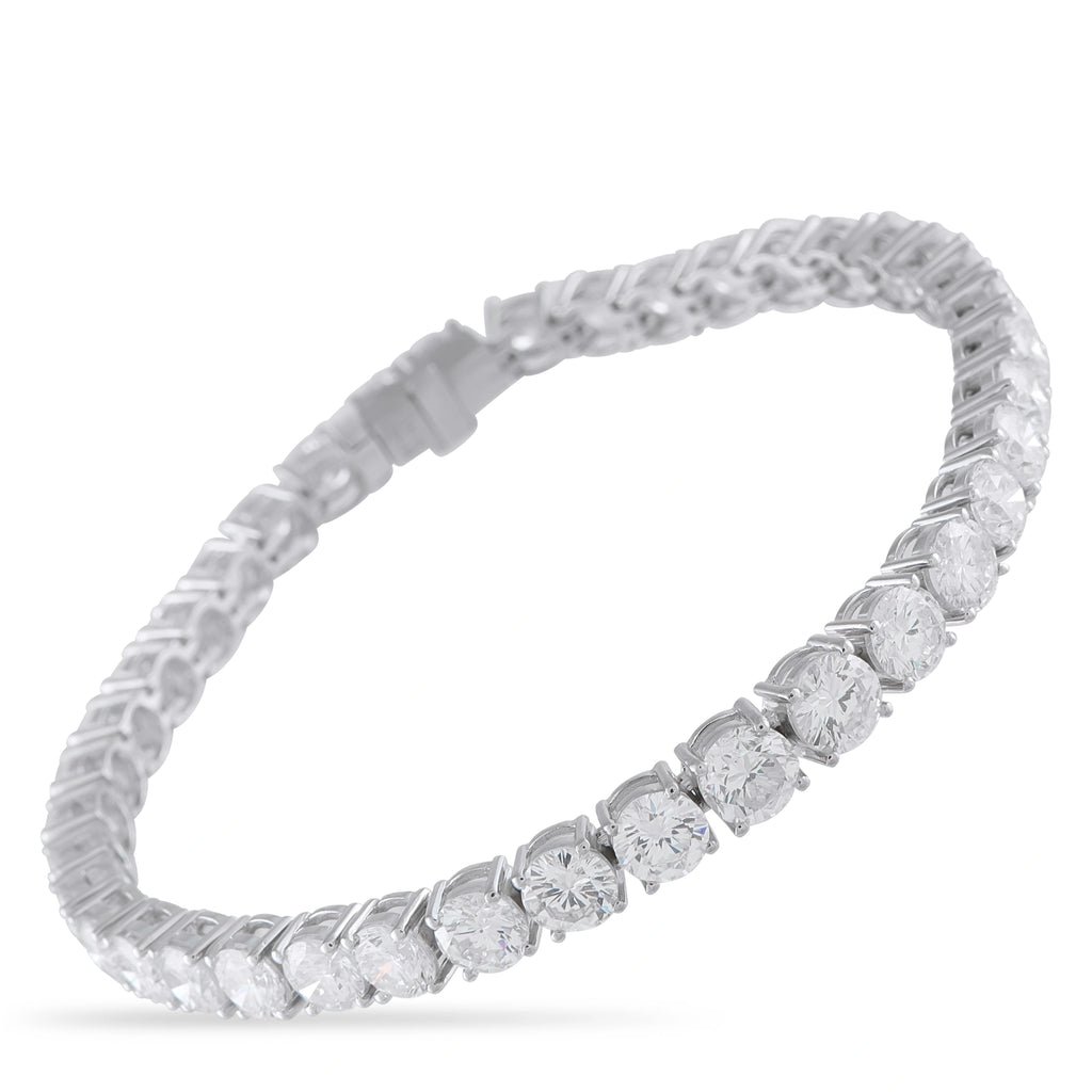 Platinum-toned diamond tennis bracelet with evenly spaced round stones