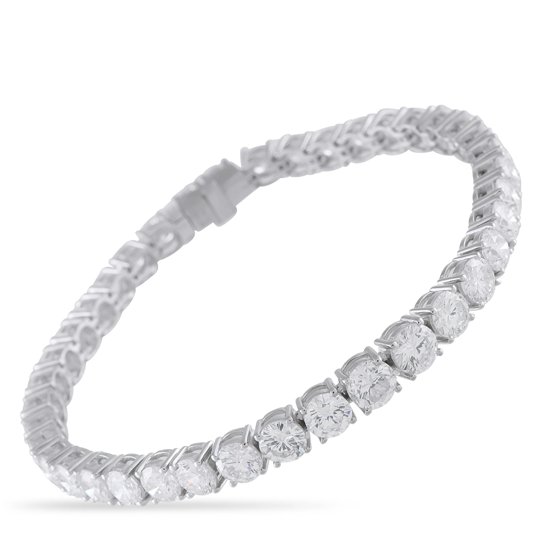 Platinum-toned diamond tennis bracelet with evenly spaced round stones