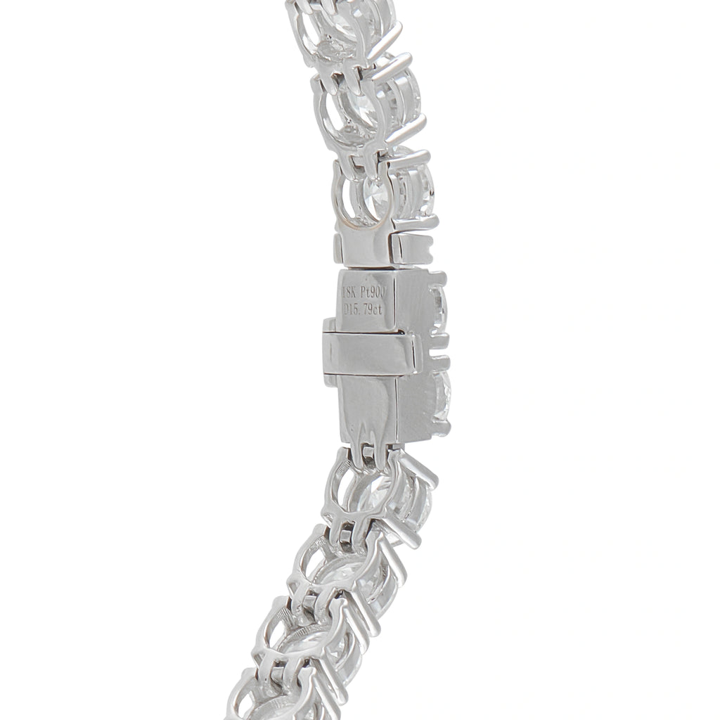 Platinum-toned diamond bracelet clasp with linked stone setting and hallmark