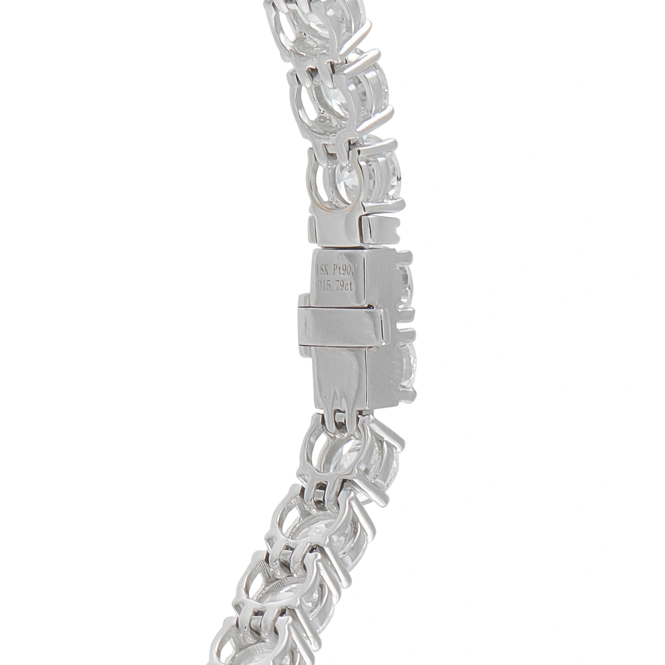 Platinum-toned diamond bracelet clasp with linked stone setting and hallmark
