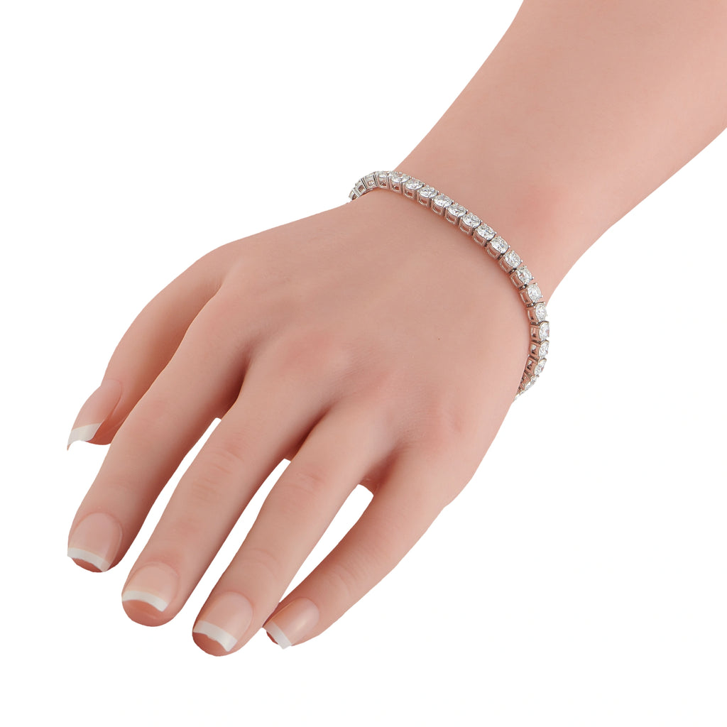 Platinum diamond tennis bracelet on a hand