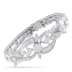 Platinum diamond tennis bracelet with vintage geometric links and central floral cluster