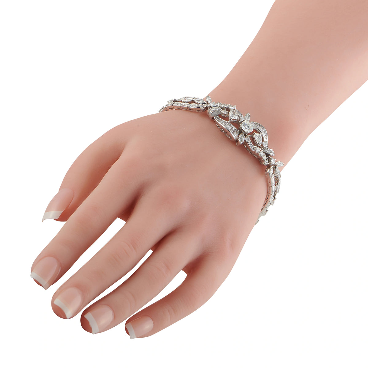 Platinum diamond bracelet on wrist with sparkle row and openwork floral design