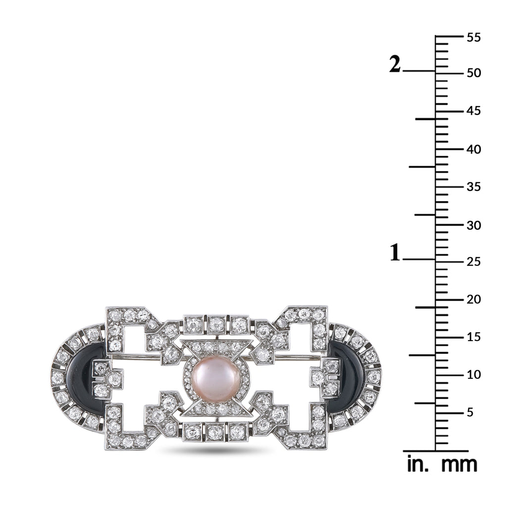 Art Deco brooch shown with mm ruler, pearl center and onyx insets