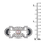 Art Deco brooch shown with mm ruler, pearl center and onyx insets