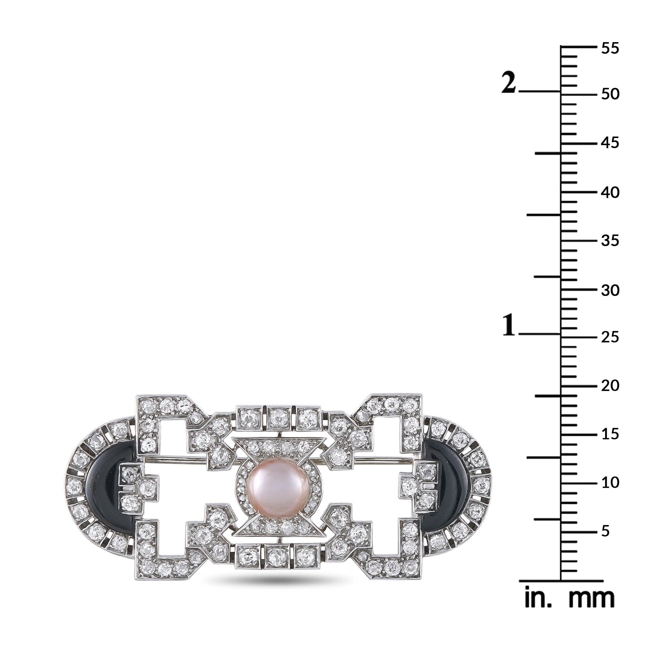 Art Deco brooch shown with mm ruler, pearl center and onyx insets