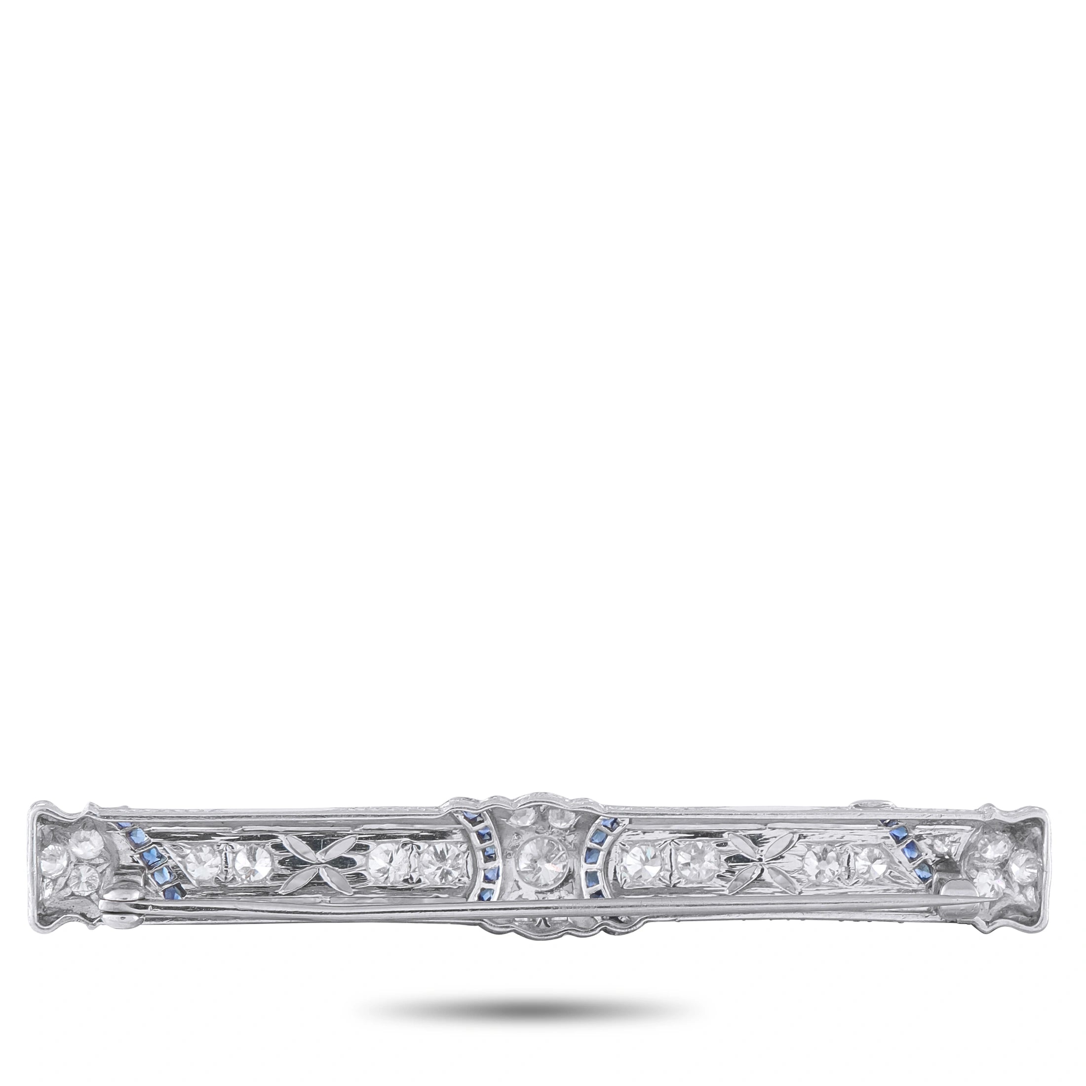Platinum diamond bar pin with blue sapphire accents, central oval stones