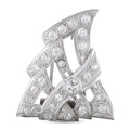 Platinum triangular diamond brooch with openwork design and round center stone