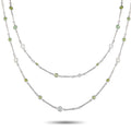 Platinum two-strand necklace with oval diamonds and small round green gemstones