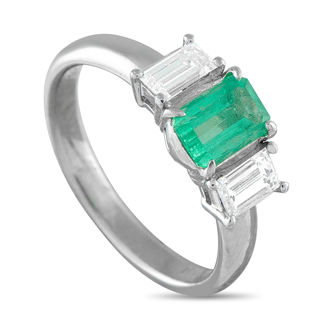 Exclusive Platinum 0.65ct Diamond and Emerald Ring - A classic three-stone setting makes this luxury ring truly timeless in design. Chic and incredibly sophisticated, it features