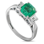 Platinum 0.42ct Diamond and Emerald Ring - An ornate Platinum setting makes this luxury ring interesting from every angle. Classic and incredibly chic, it features a 1.