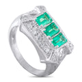Platinum ring with green emerald-cut stones and diamond pavé