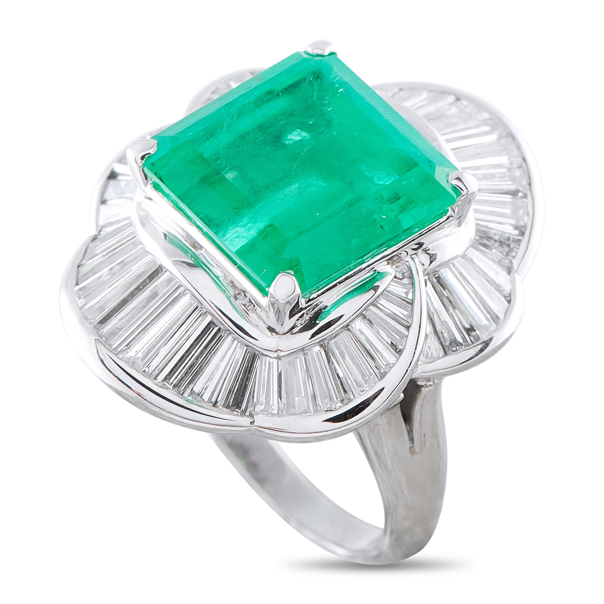 Platinum ballerina ring with emerald-cut green gemstone and diamond baguette halo