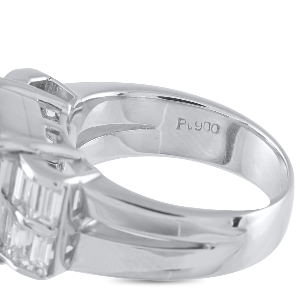 Platinum ring band with engraved hallmark and emerald-side prong detail with diamonds