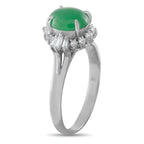 Platinum jade ring with oval green center stone and diamond baguette halo detail