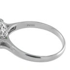 Platinum ring band with side view and engraved markings near the base