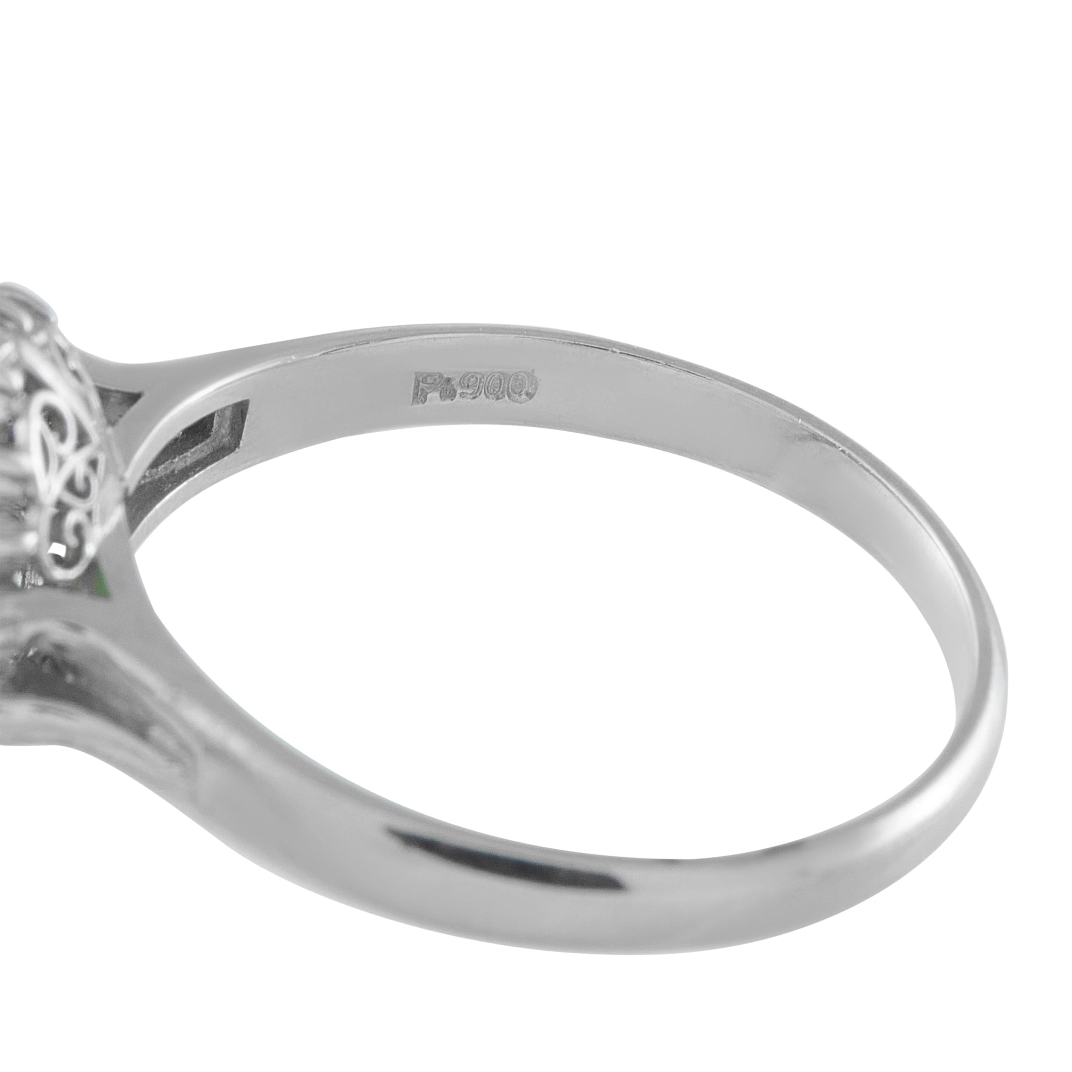 Platinum ring band with side view and engraved markings near the base
