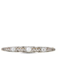 Platinum brooch with pearl center and diamond accents