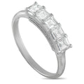 Platinum diamond ring with baguette-style stones in a raised band, side angle