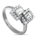 Silver diamond ring with three square emerald-cut stones and round diamond accents