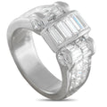 Platinum diamond ring with three rectangular baguette-style stones and round side diamonds