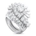 Platinum diamond ring with prong-set round and oval stones, wide band