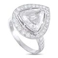 Platinum diamond ring with triangular center stone and pavé halo