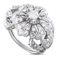 Platinum diamond cluster ring with central round stone and scalloped halo