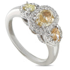 Platinum diamond three-stone halo ring with round yellow center and side stones