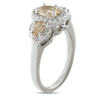 Platinum diamond halo three-stone ring, round yellow center stone with sparkling side stones