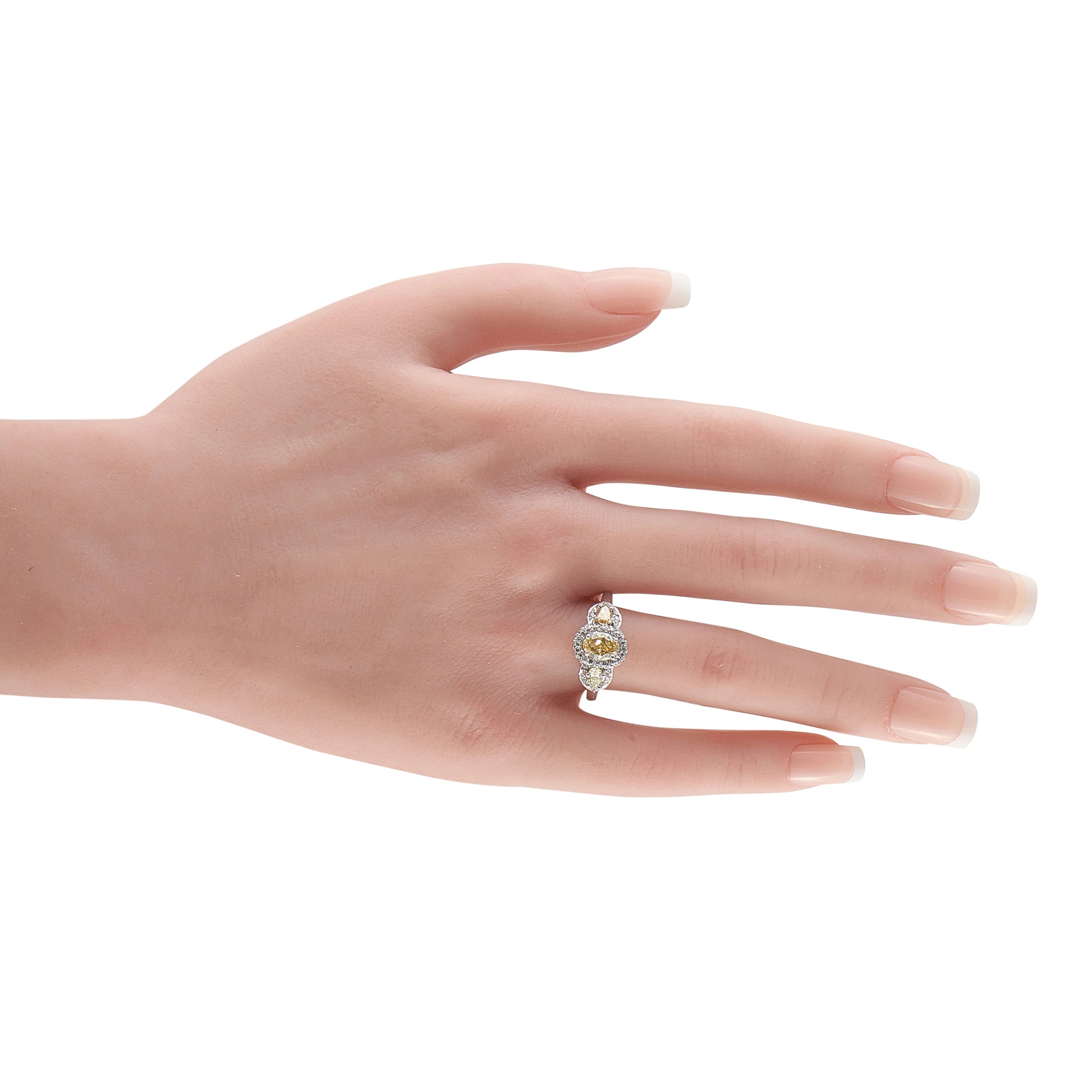 Platinum diamond three-stone halo ring on hand