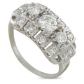 Platinum art deco diamond ring with round stones in a carved band