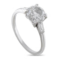Platinum diamond engagement ring with round center stone and baguette side diamonds