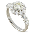 Platinum diamond ring with a large center stone, halo setting, and diamond-set shoulders