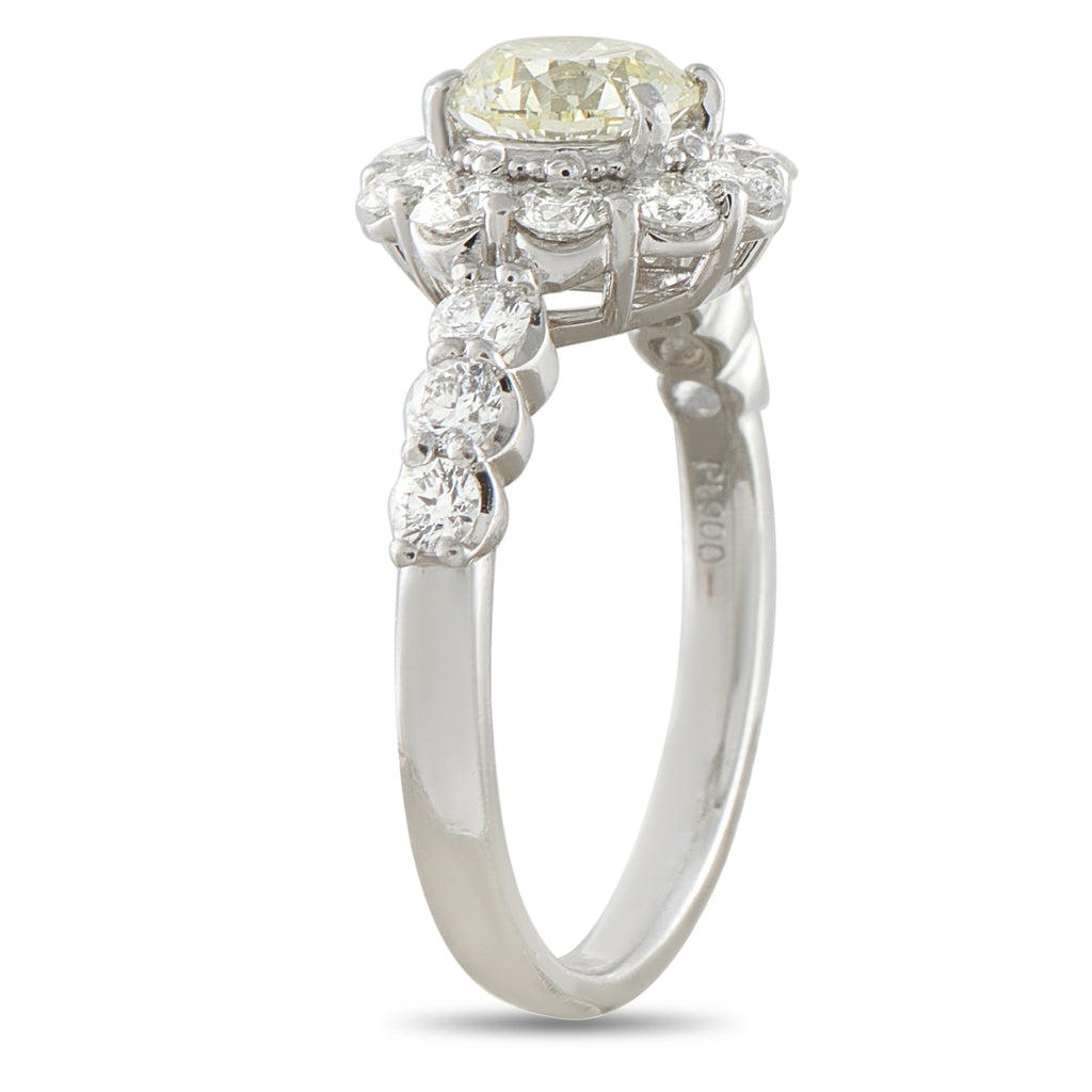 Platinum diamond ring shown from the side, revealing its raised setting and diamond shoulders