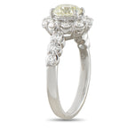 Platinum diamond ring shown from the side, revealing its raised setting and diamond shoulders