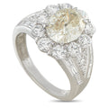 Platinum diamond ring with a large cushion-cut center stone, halo, and baguette side stones
