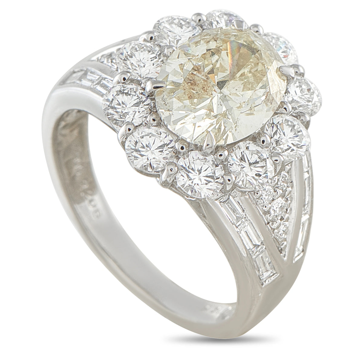 Platinum diamond ring with a large cushion-cut center stone, halo, and baguette side stones