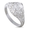 Platinum antique diamond ring with oval center stone and filigree halo