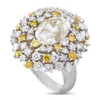 Platinum diamond ring with a large central diamond and a cluster of white and yellow diamonds