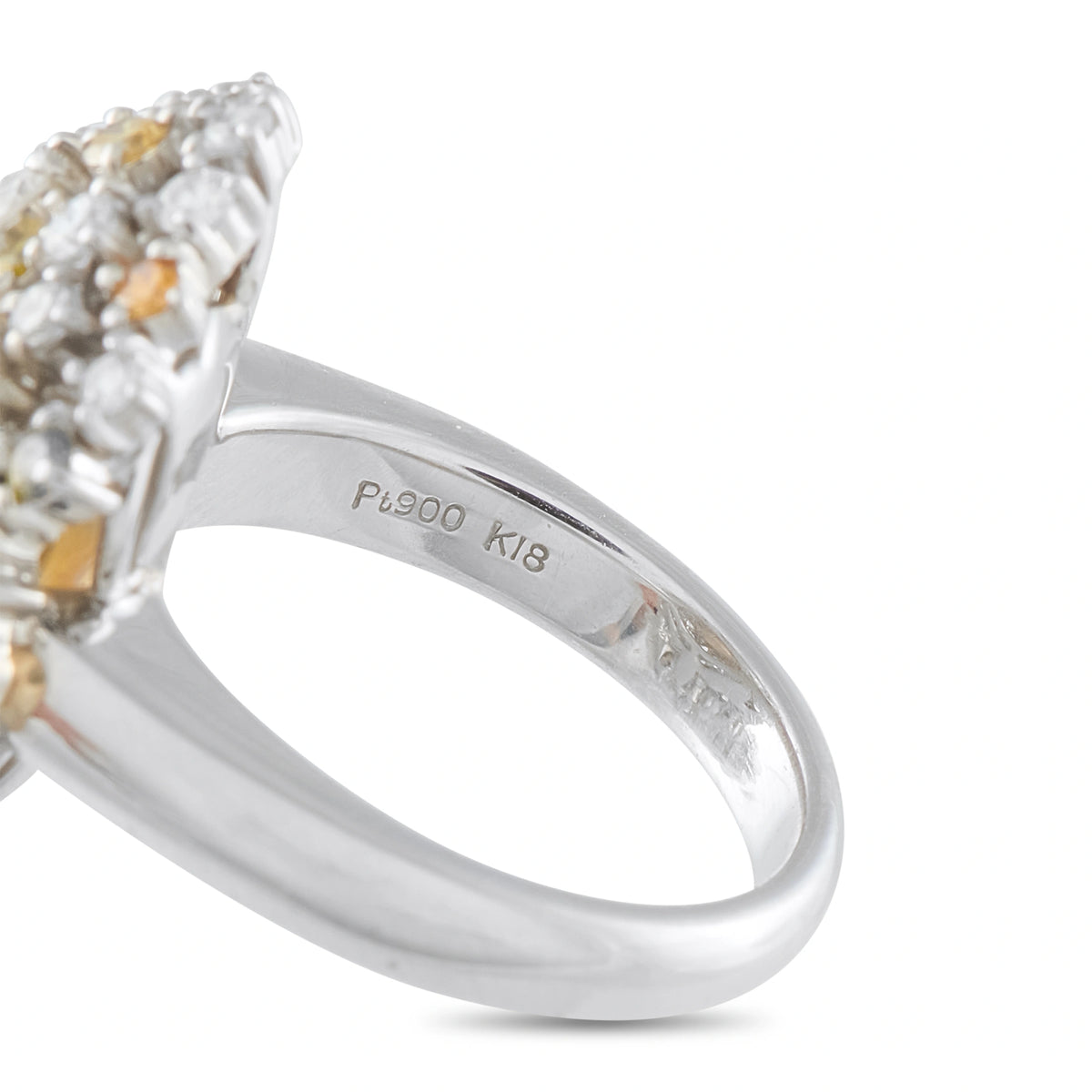 Platinum diamond ring detail showing the smooth band and Pt900 K18 hallmark