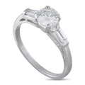 Platinum diamond ring with round center stone and baguette side diamonds
