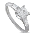 Platinum ring with emerald-cut solitaire center diamond and baguette side stones