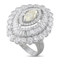 Diamond halo ring with oval light-yellow center stone and round diamond accents