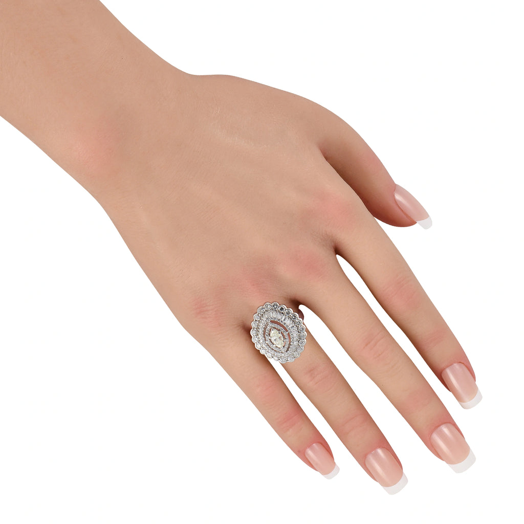 Diamond halo ring on hand, oval center stone with round halo and prong setting