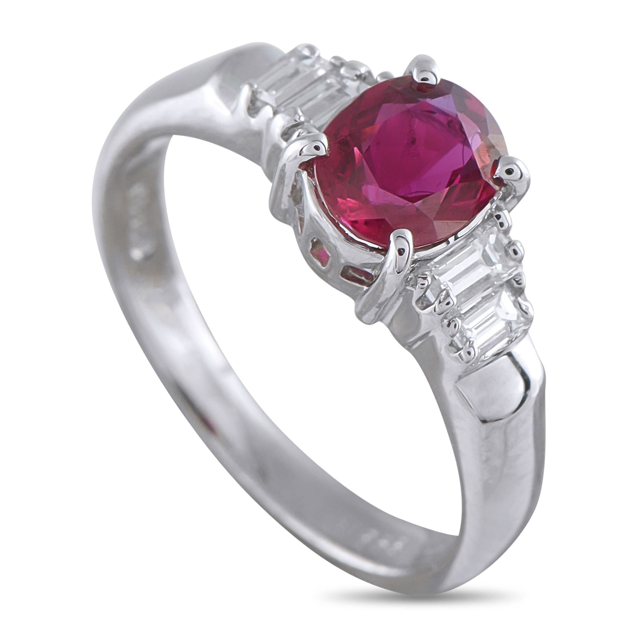 Exclusive Platinum 0.20ct Diamond and Ruby Ring - This platinum ring showcases an oval 0.86-carat ruby center stone, accented by stepped side stones of baguette diamonds. The