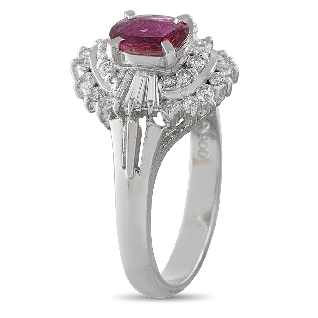 Platinum ring with oval ruby center, diamond halo, side prongs visible