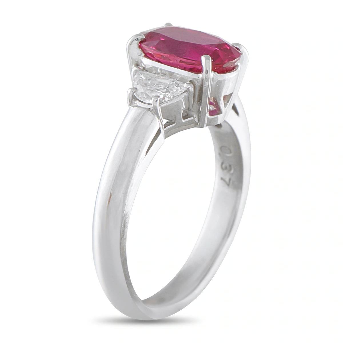Platinum ring side view showing the raised ruby setting and diamond accents